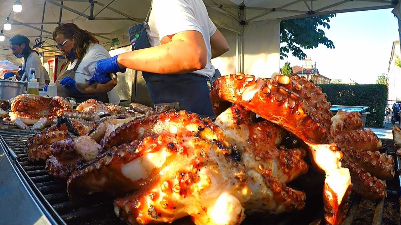 Italy Street Food Event. Huge Octopuses on Grill, Juicy Churrasco, Roasted Meat and more Food