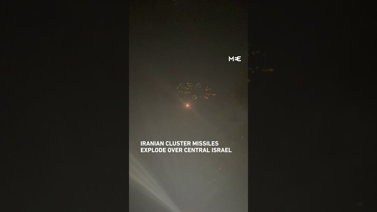 Iranian cluster missiles explode over central Israel amid exchange of fire with Iran