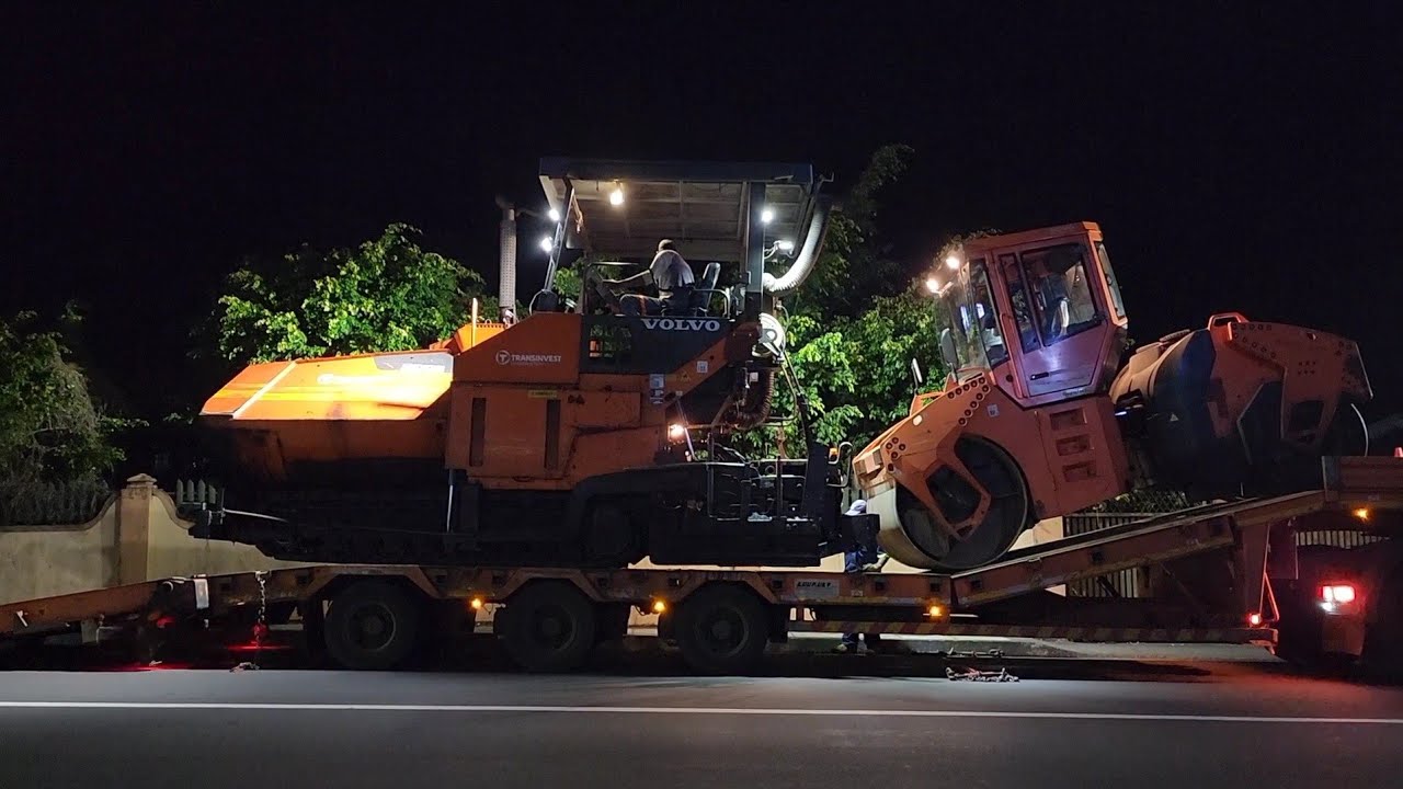 Loading Volvo ABG7820 paver & Bomag BW 161AC on low-bed in Mauritius