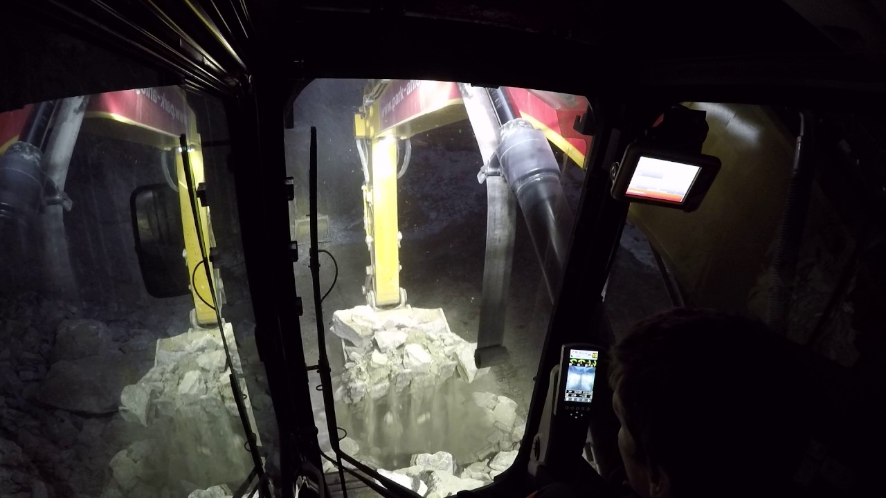 Cat 352 F XE loading blasted rock on ADT's, incab view