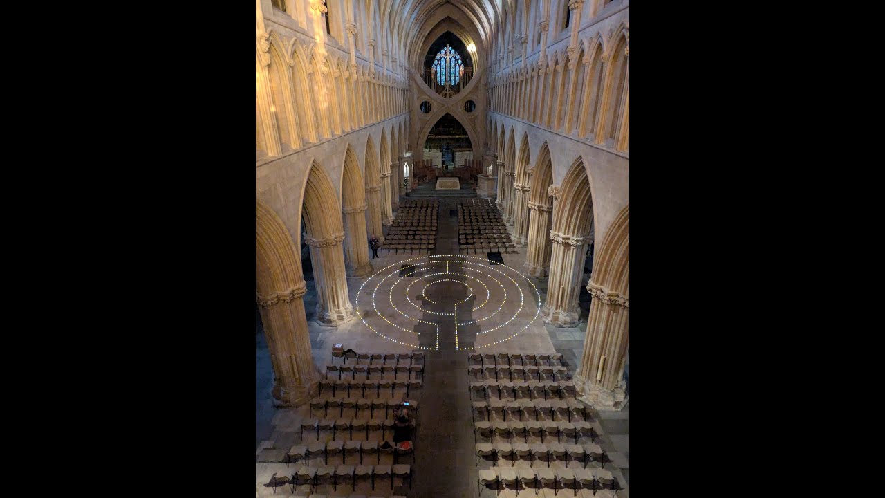 Guy Hayward and Tara Swart walking - and chanting - on my labyrinth in Wells Cathedral.