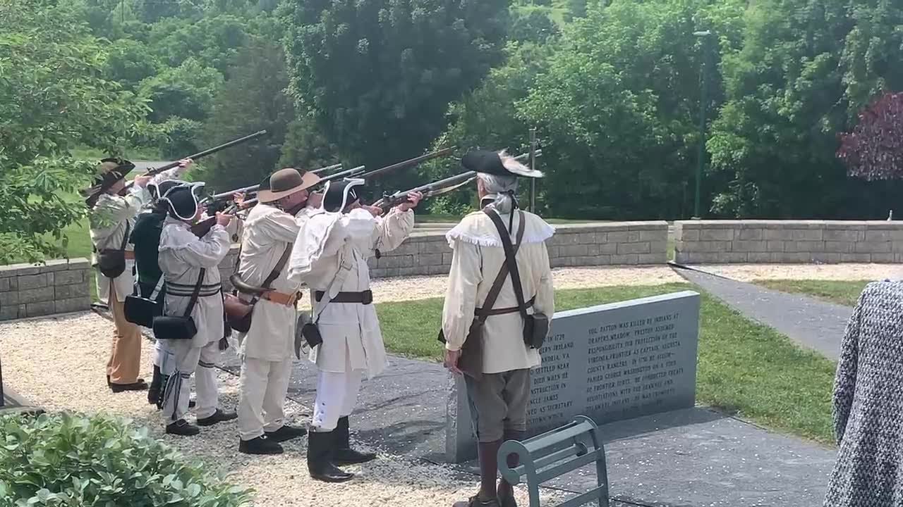 Sons of the American Revolution color guard shoot ceremonial guns at the Col. William Preston