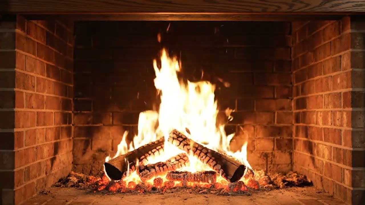 The serenity of a fireplace firewood burning slowly with a natural crackling sound