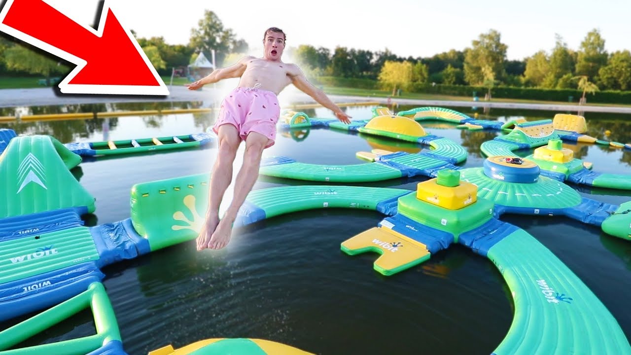 CRAZY TRICKS ON HUGE WATER TRAMPOLINE PARK !!