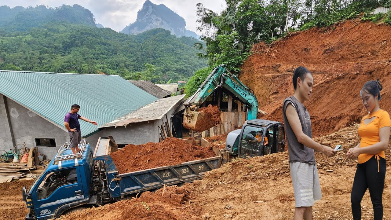 excavator, car the finishing carrying land landslide Entering the farmer's house.
