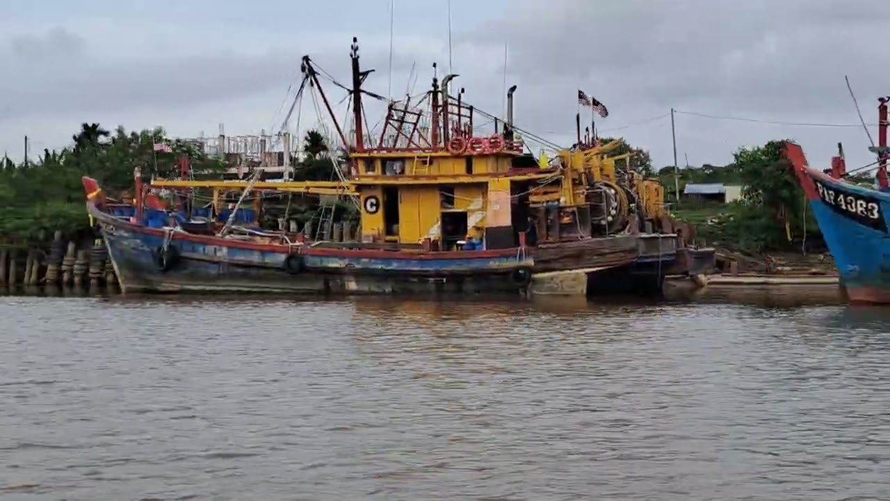 Kuantan riverboat cruise down the river past fishing boats, otters and crocodiles.