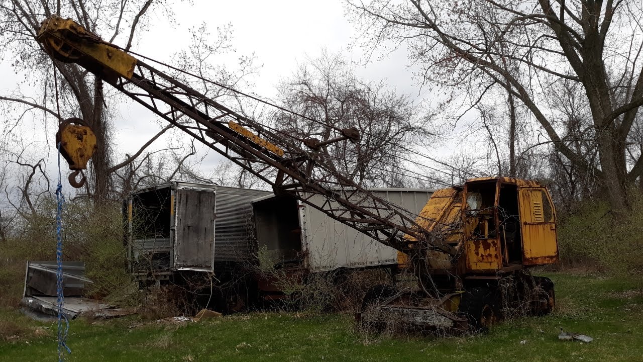 FOUND AN ANTIQUE CRANE AND SOME OLD TRAILERS