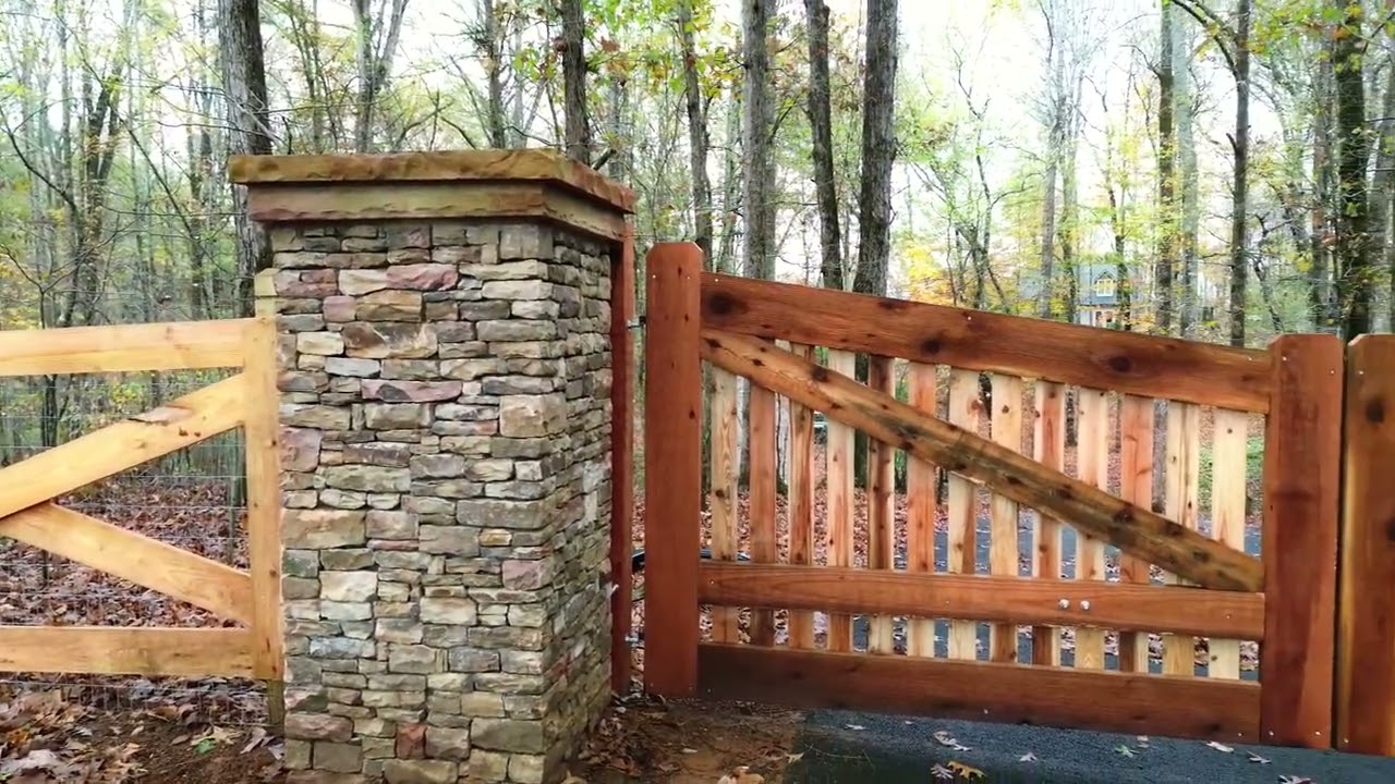 North Atlanta Fence & Gate Company - Custom Cedar Driveway Gate, Stone Columns & Fencing