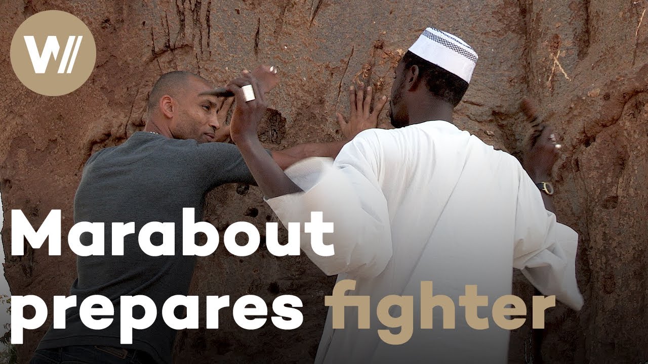 African marabout conducts magic rituals to help wrestlers
