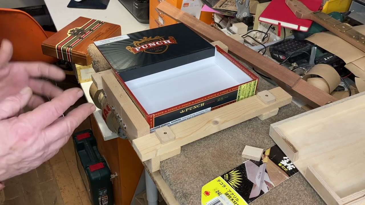 Simple jig for fitting neck to cutting a cigar box to take neck.