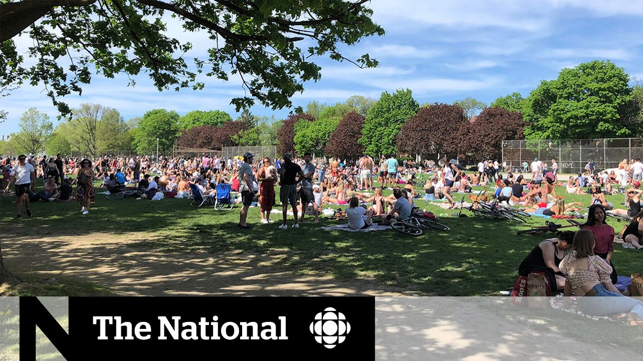 People crowd Toronto park as COVID-19 restrictions compete with summer weather
