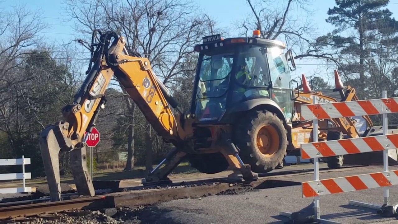 [HD] CSX CASE 580N BACKHOE Ripping Up 3rd Street Crossing In Maxton NC