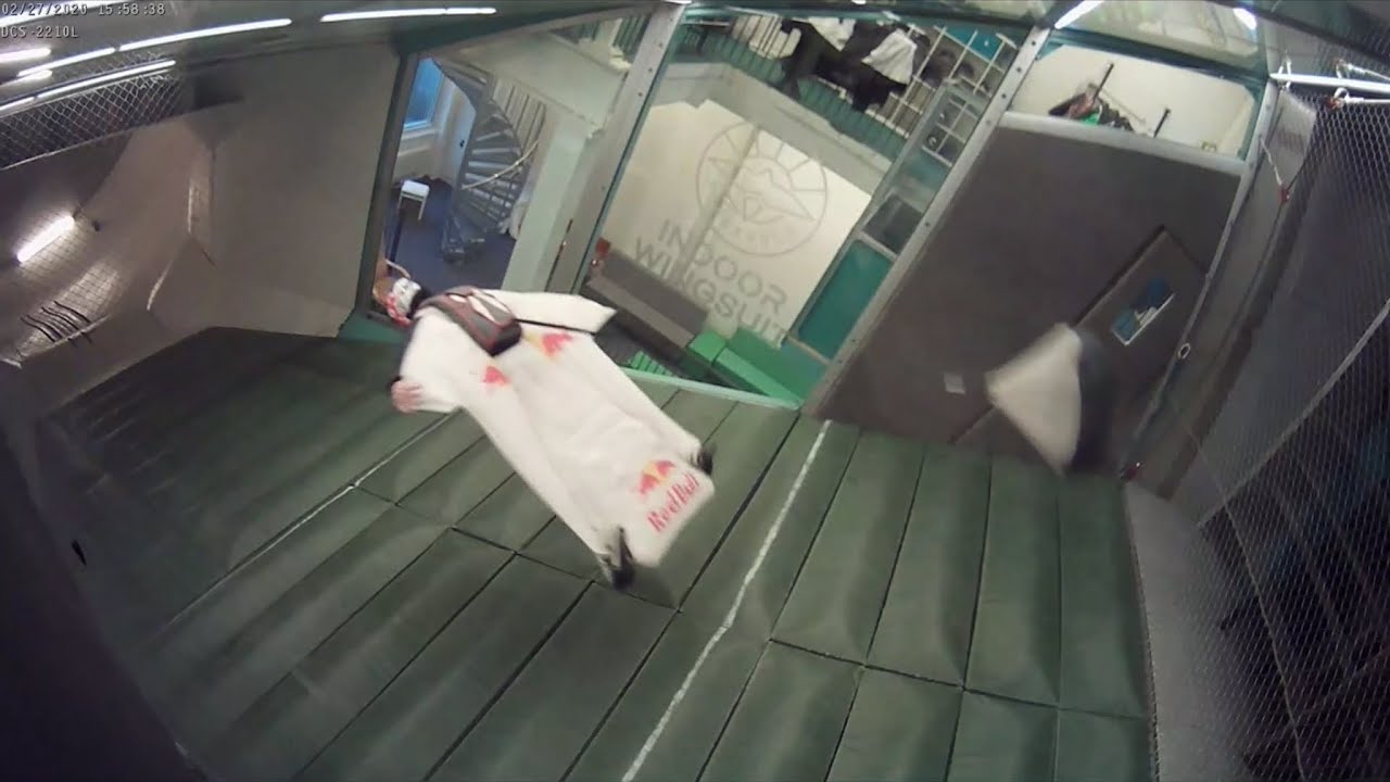 Indoor wingsuit tunnel stockholm dani roman flying acrobatics deploys pilochute