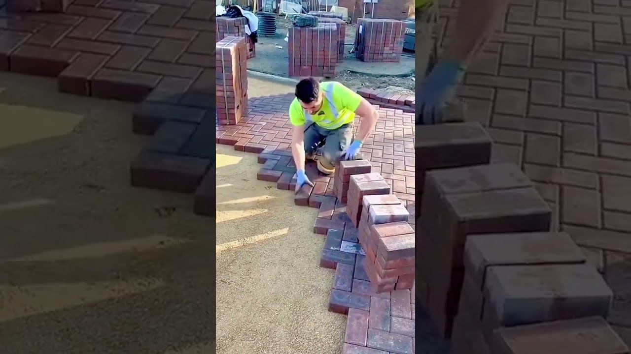 Expertly Laying Interlocking Brick Pavers on a Prepared Gravel and Sand Base