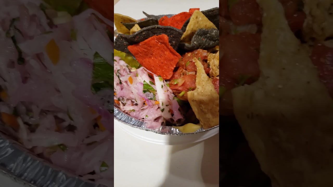 Chicken, tricolor nachos, rice, salsa, beans dip, purple coleslaw, cheese dip and hot green peppers