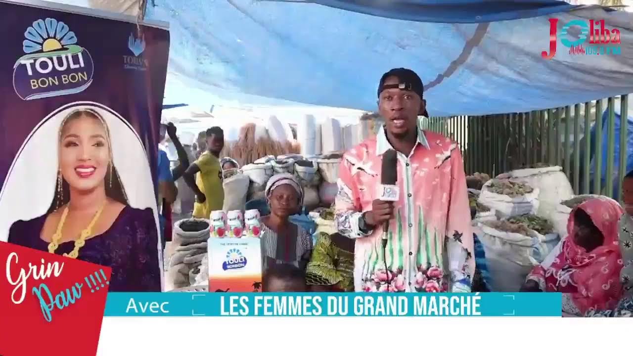 Grin Paw  avec les femmes du marché