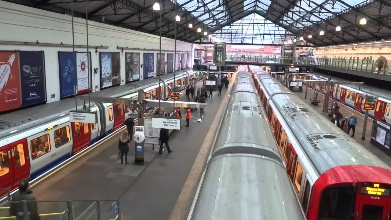 8 District Line trains at Earl's Court