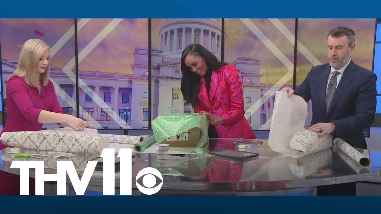 Brooke, Faith, and Nathan show off gift wrapping skills