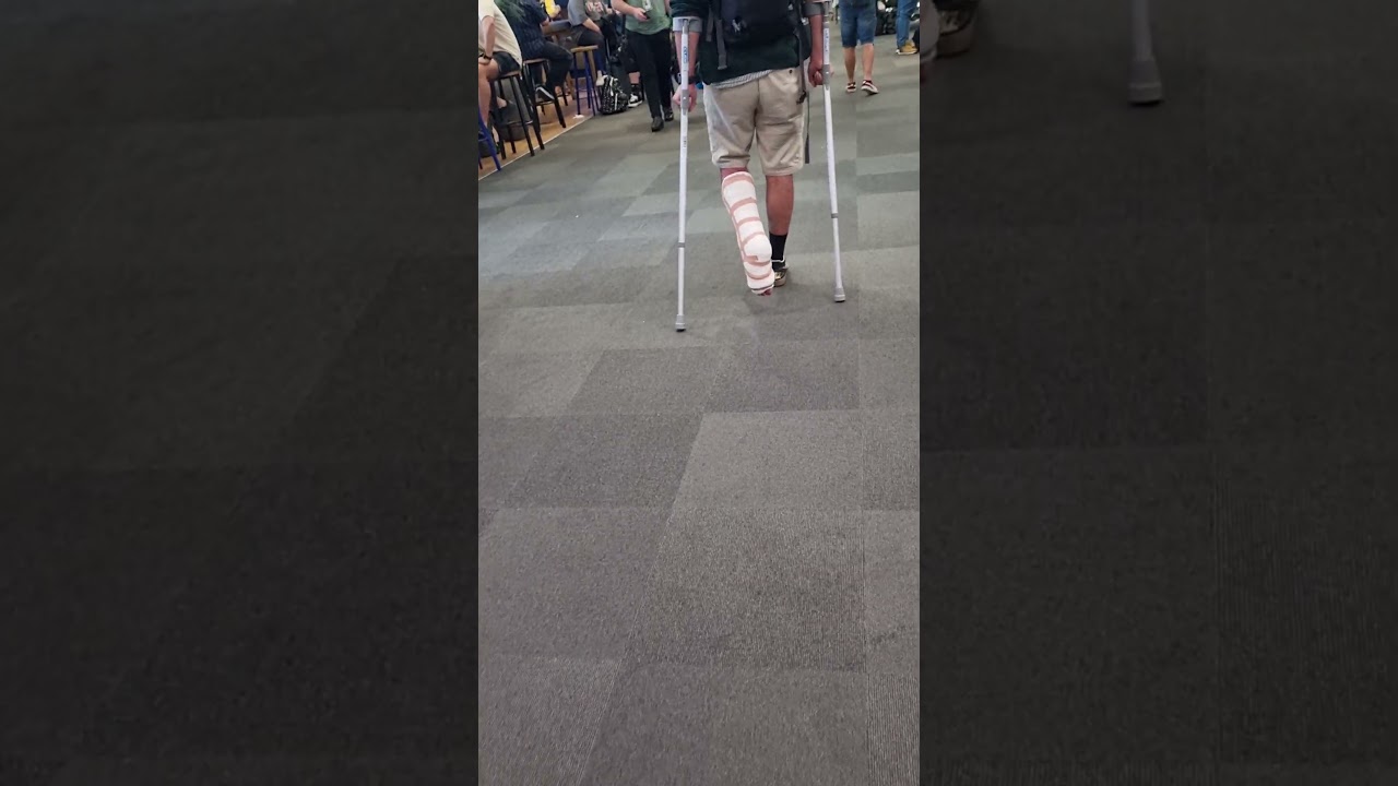 Guy in a plaster cast and crutches