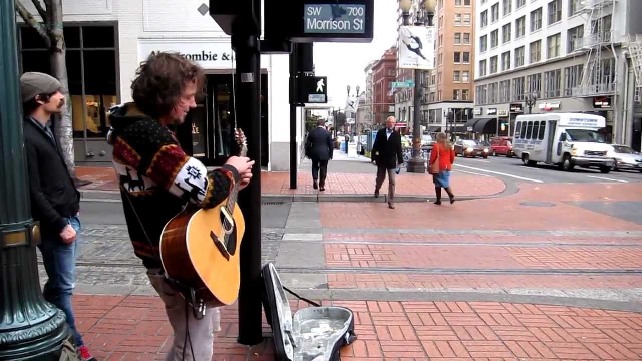 Guitarist Andrew Gorny busking in Portland