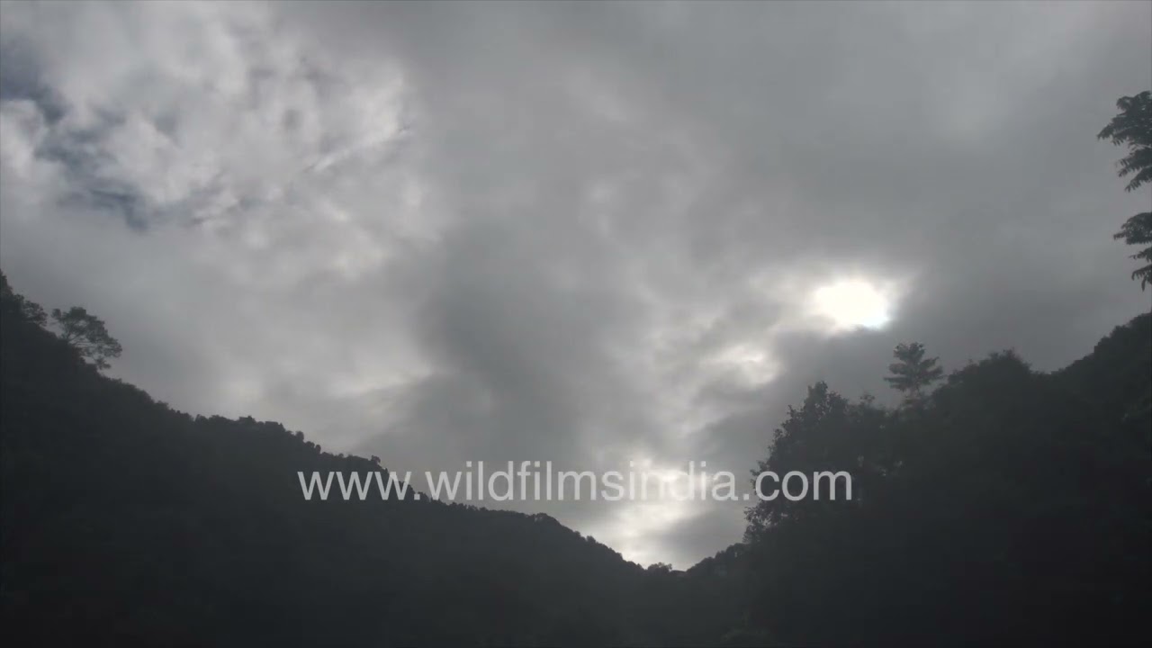 Clouds drifting across Himalayan foothills timelapse view
