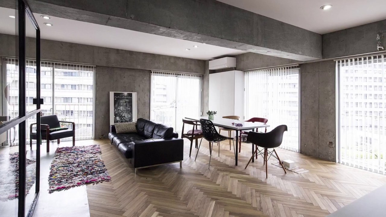 Renovated Condo in Tokyo with a Revolving Door and Concrete Walls