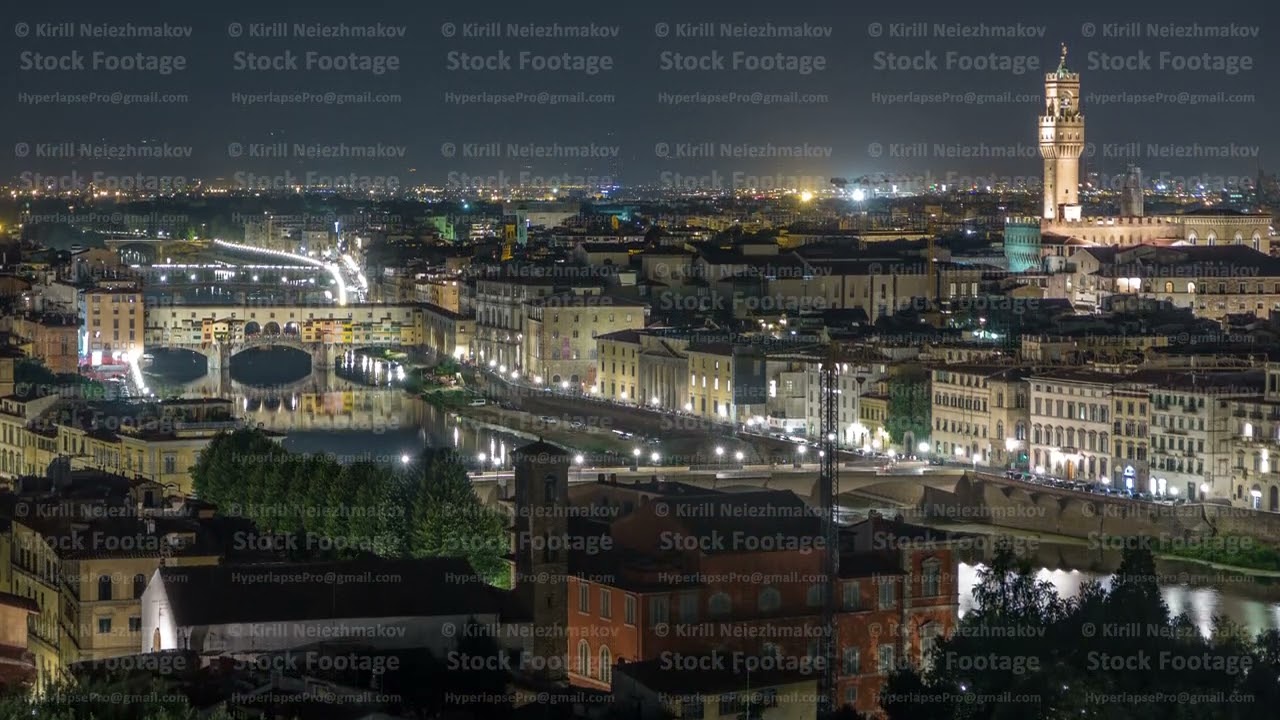 Famous Arnolfo tower of Palazzo Vecchio timelapse and Arno River at night in Florence, Tuscany