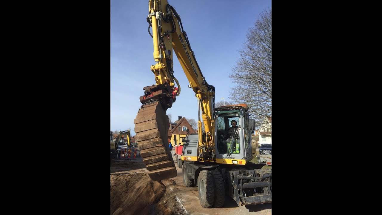 New Holland We150c with bigab trailer