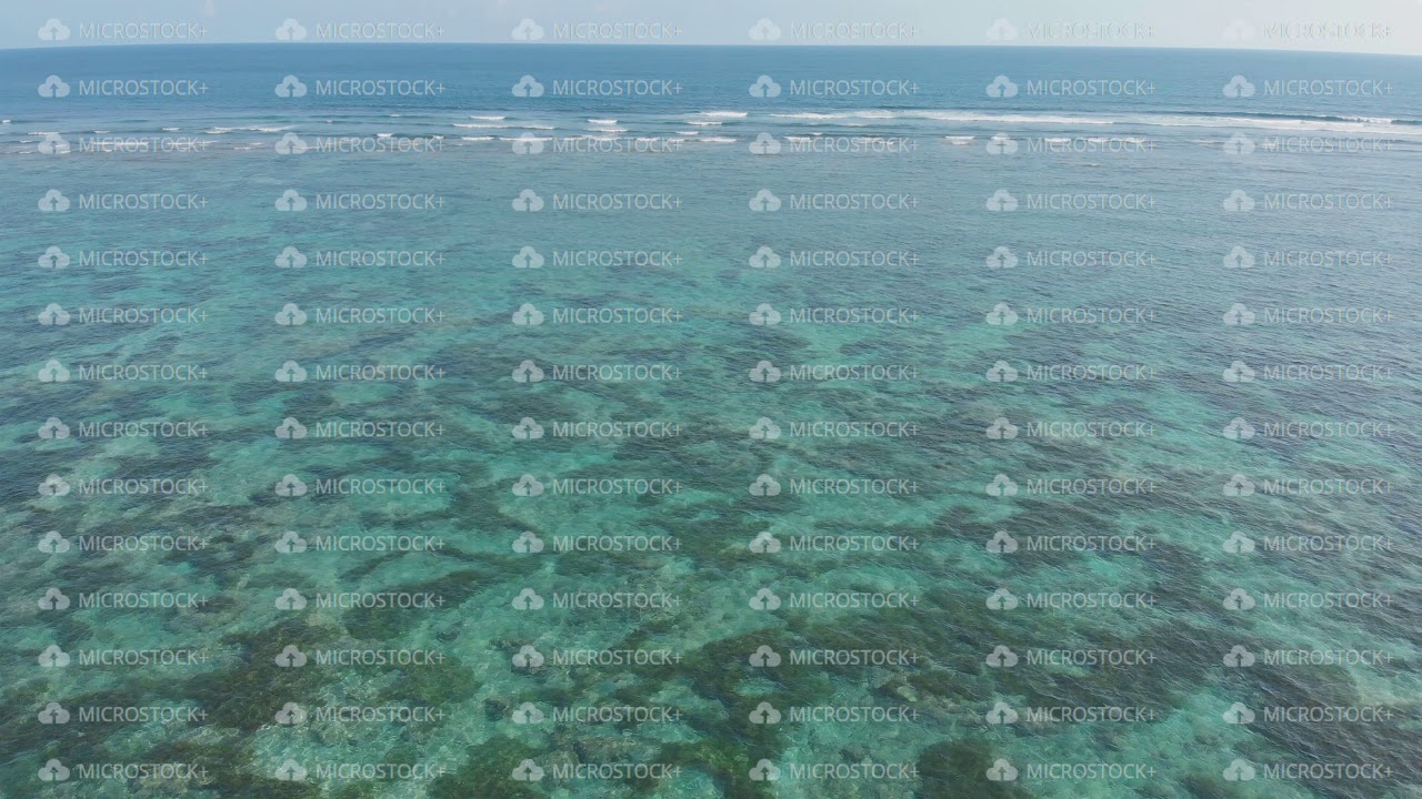 Aerial view of the beautiful ocean floor with reefs near Pantai Pandawa. Indonesia.