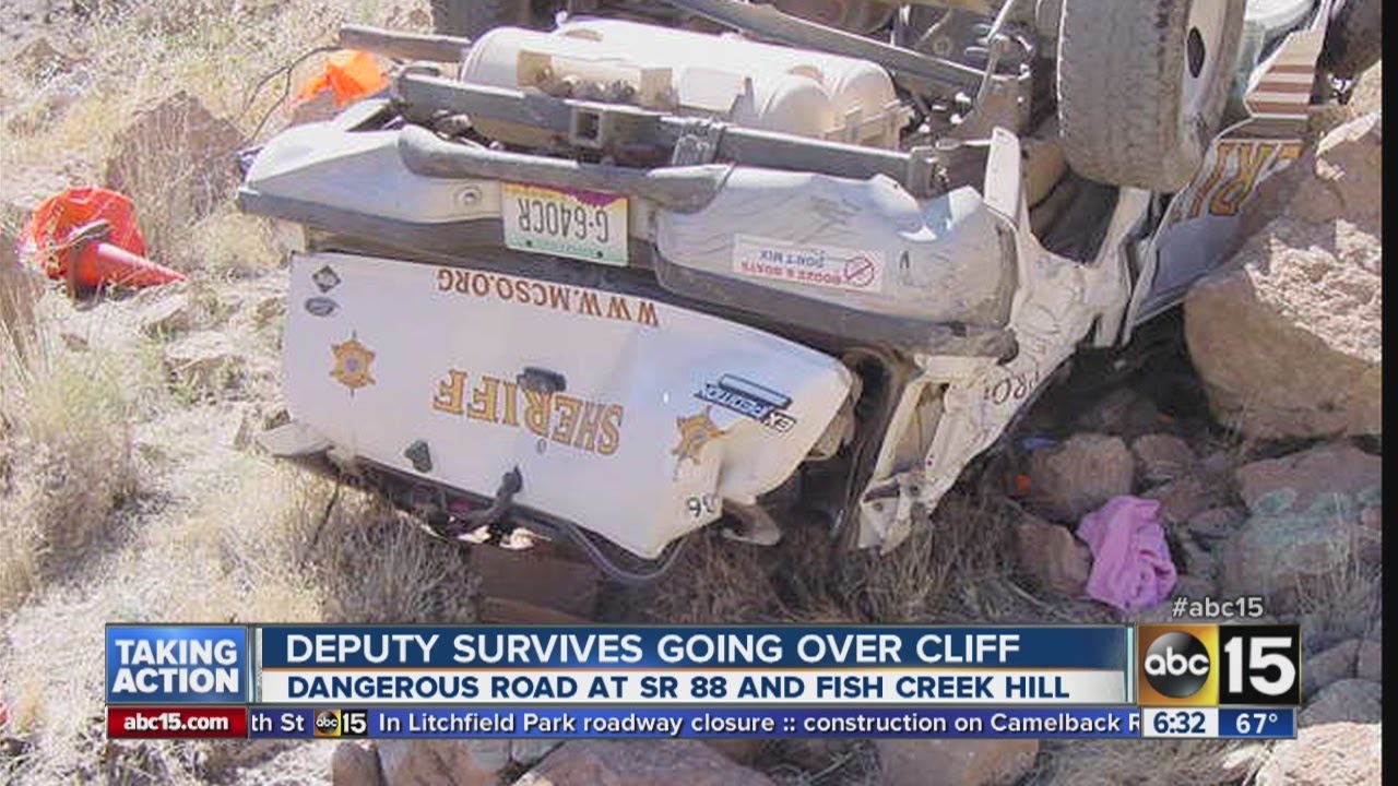 Deputy survives going over cliff