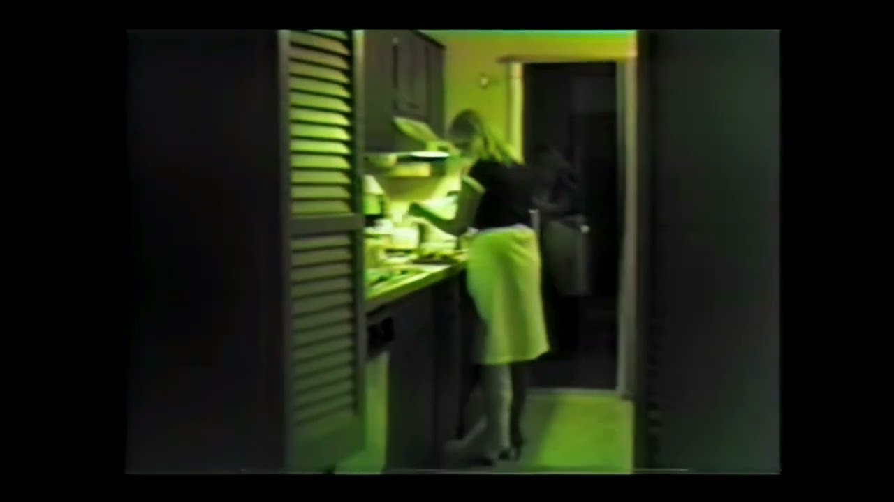 SLWC lady in kitchen E720p brighter