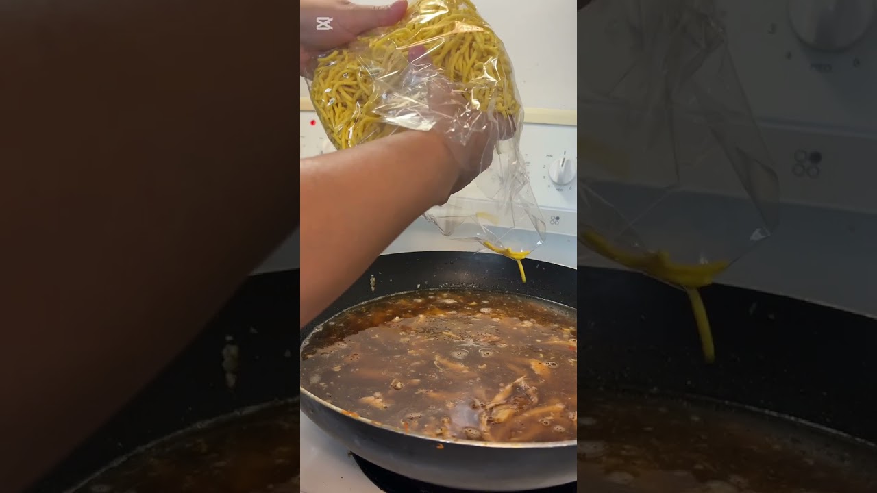 Cooking fry noodles traditional Filipino dishes Pansit