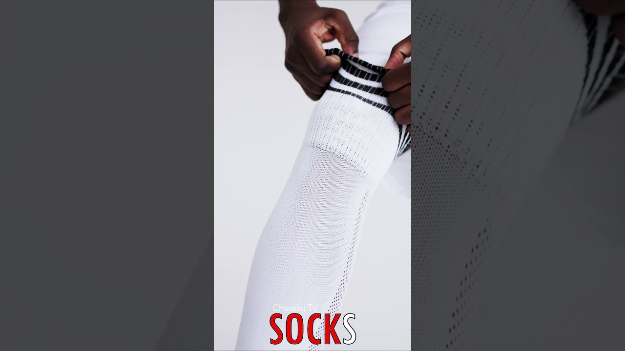 🧦 #SOCKS -  Soccer Player's Stylish White Knee-High Socks Set the Stage for Victory 🦵🏻