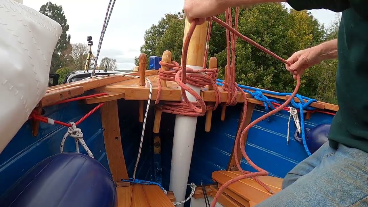 Ilur cruising dinghy. Using belt and braces to keep Tilly's mast up.