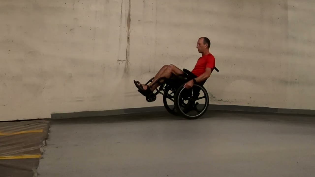 Downhill wheelchair wheelies