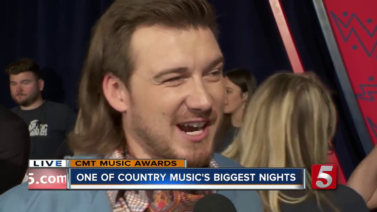 Morgan Wallace walks CMT Awards blue carpet