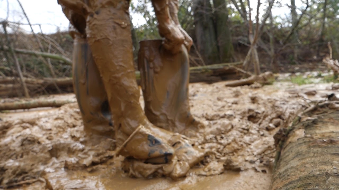 Rubber riding boots and rainwear in clay mine mud 5