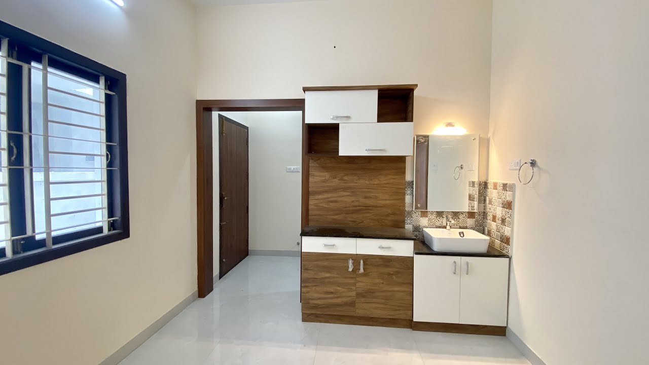 Brown & White Combo Modular Kitchen with Beautiful Crockery Unit in Dining Room