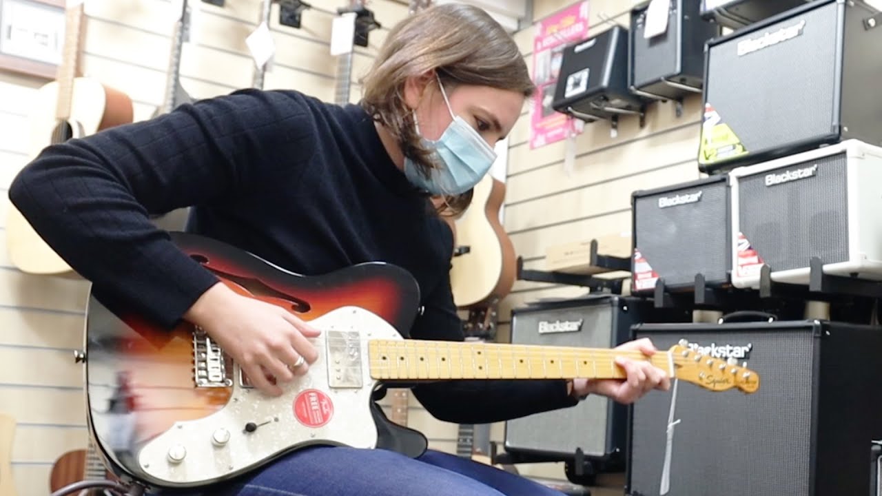 Buying Guitars For Strangers in a Special Guitar Store