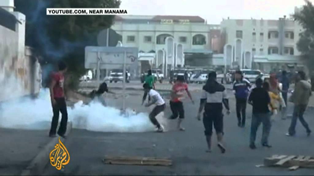 Bahrain police clash with mourners