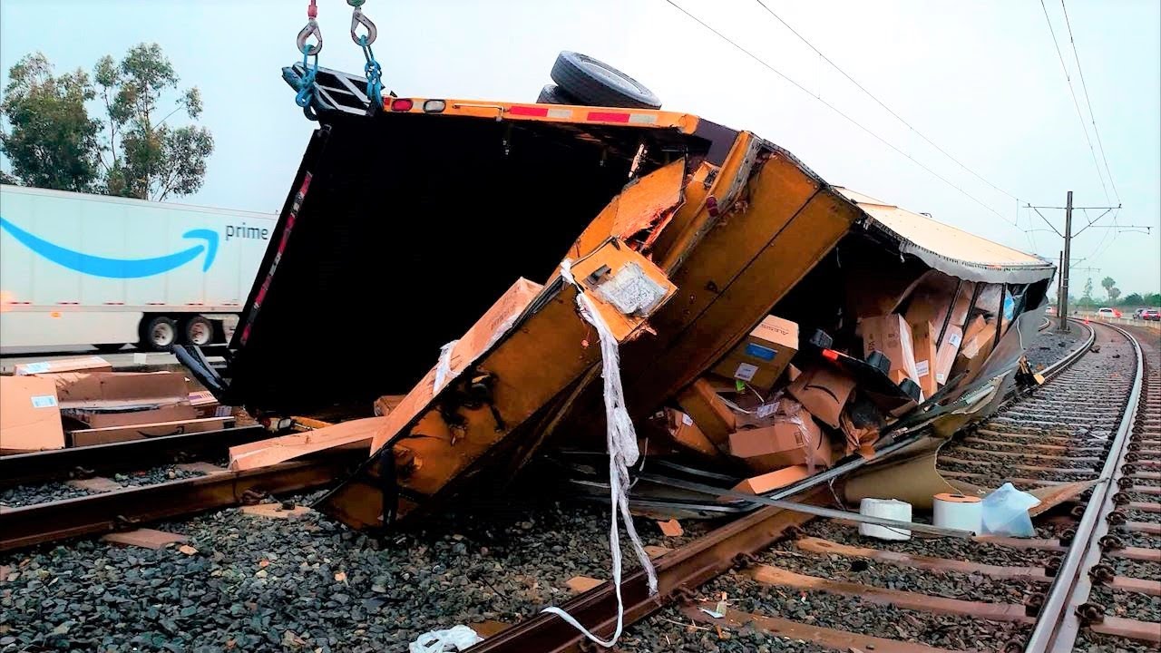 Amazon work truck crashes and flips onto train tracks