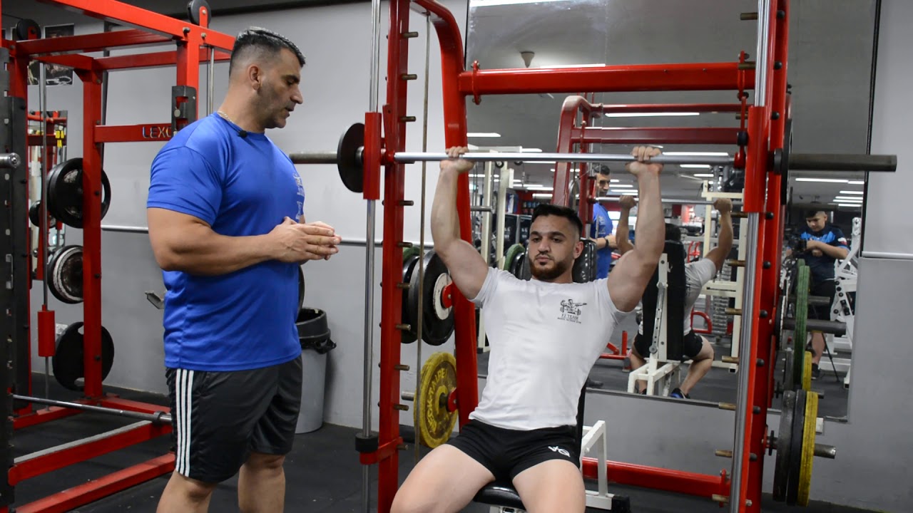 ضغط امامي جالس وسط متكئ سمث Smith Machine Shoulder Press