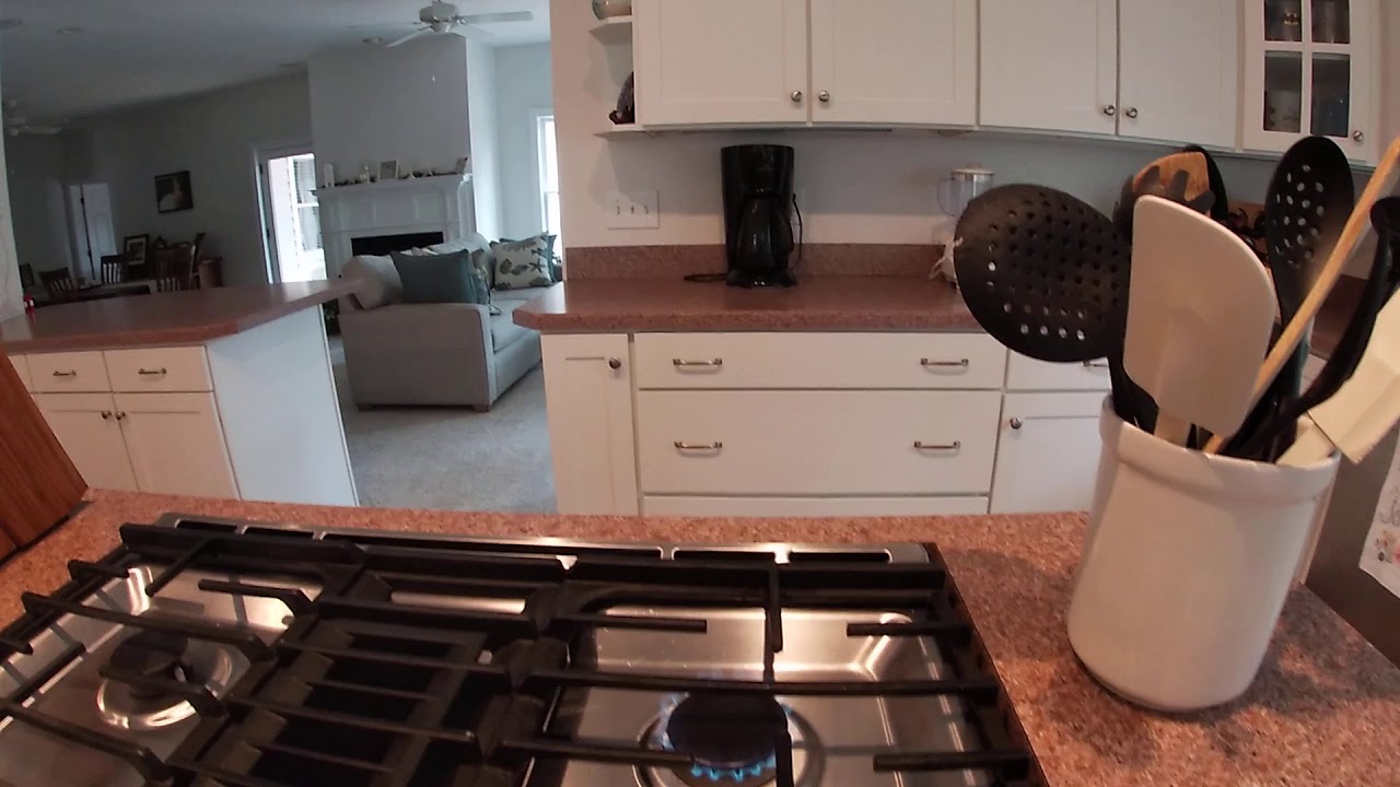 Adjusting the top burner flames on a kitchen Aid
