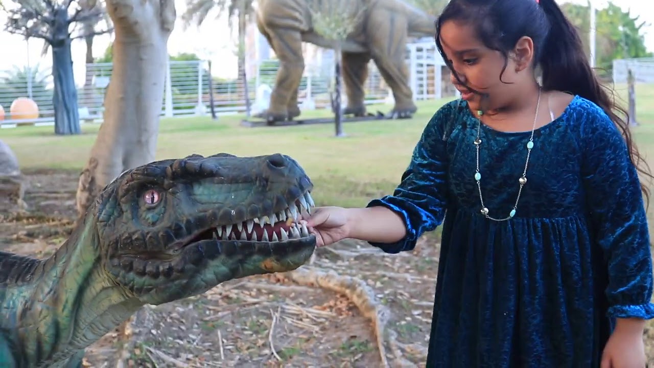 Shafa  plays in dinosaur amusement park