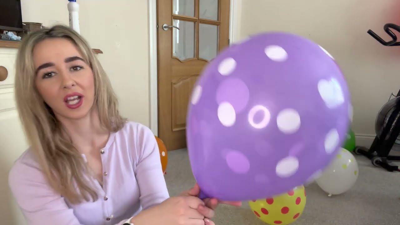 Blowing up my new polka dot themed balloons