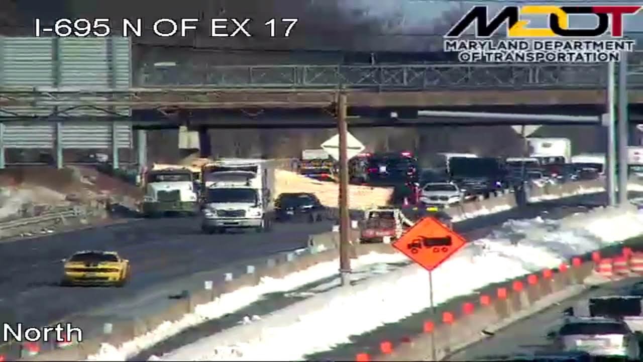 Jackknifed lumber truck blocks I-695 outer-loop near Woodlawn