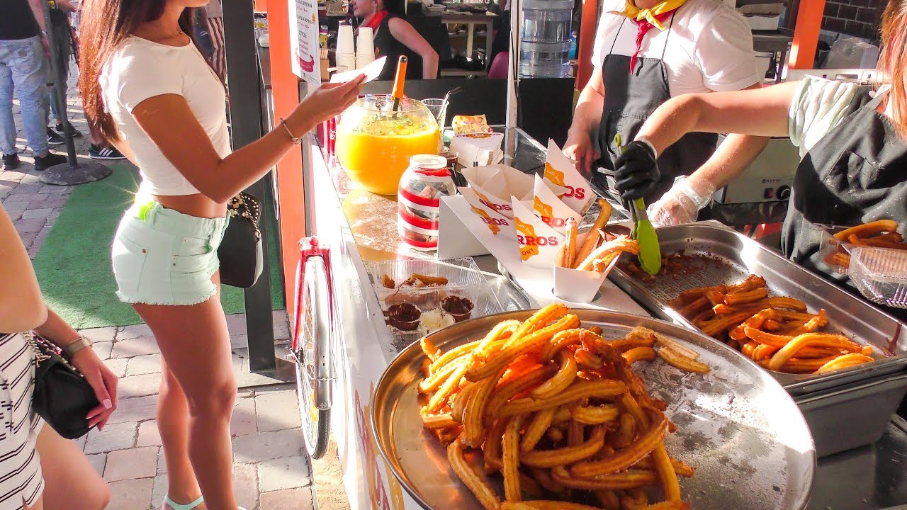 Cooking and Eating Sweet Churros in Kiev. Street Food in Ukraine