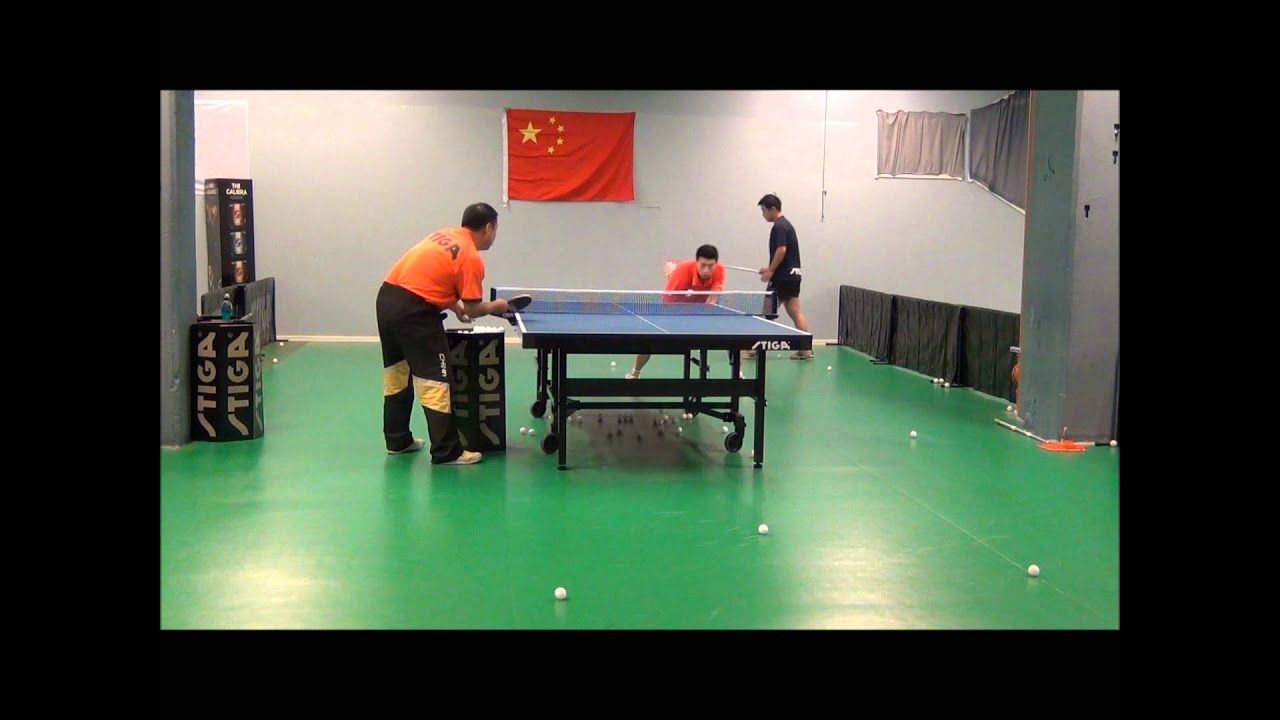 Ma Long doing multiball with head coach Liu Guoliang