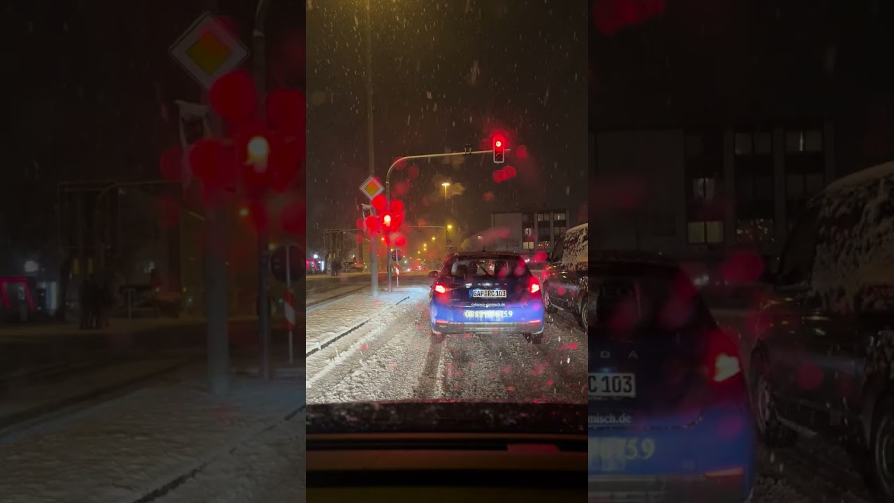 Snowing again in GaPa , Bavaria Germany last Sunday evening.