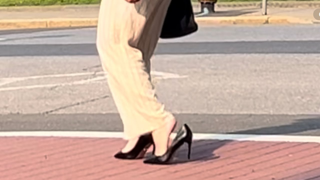 060625 - Crossdresser Walks With Loose Stiletto Heels Through The Town